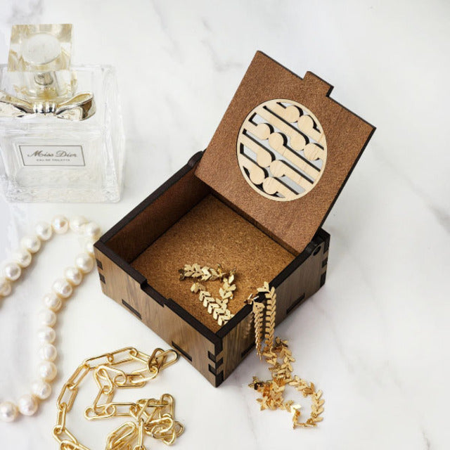 Handcrafted 8cm trinket box from reclaimed River Rimu and Pine, showcasing unique colors and New Zealand's natural beauty.