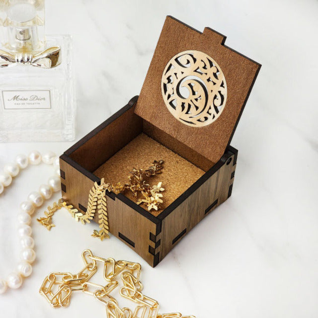 Trinket box made from reclaimed Riverwood, featuring unique Kowhaiwhai koru design, ideal for storing jewelry and keepsakes.