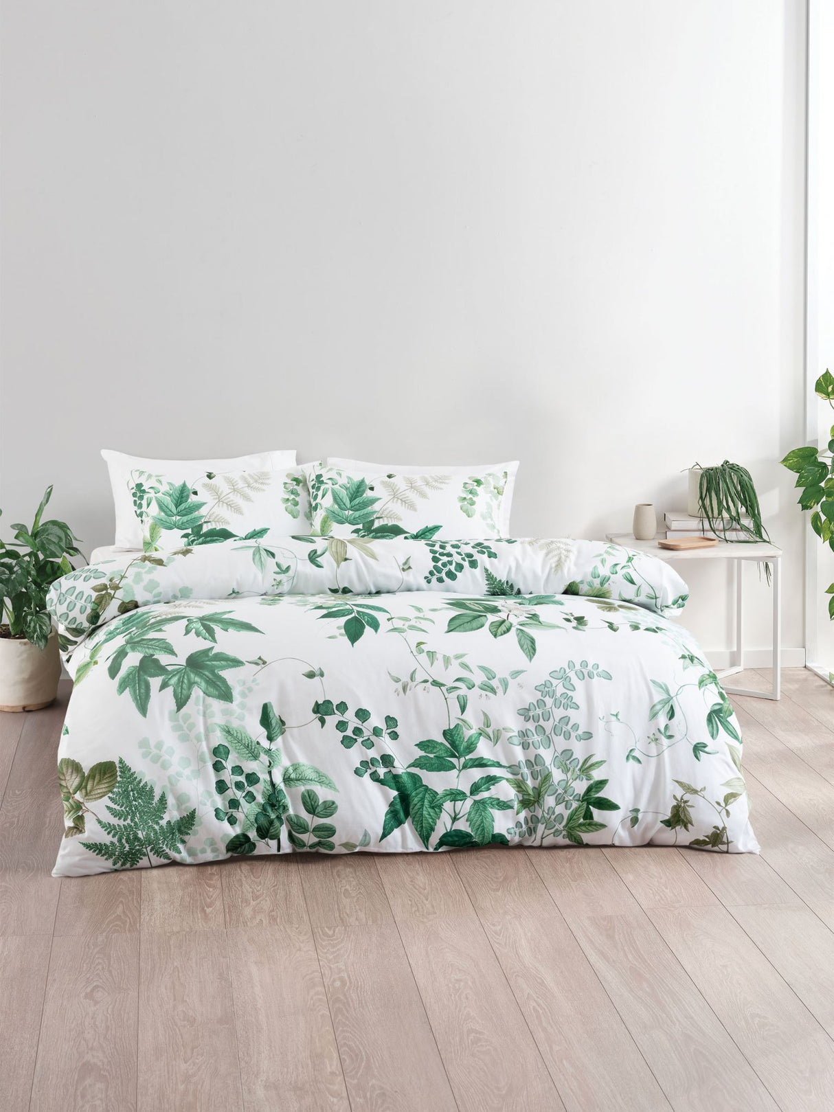 Elegant white King duvet cover set featuring intricate foliage design on soft cotton sateen for a serene bedroom oasis.