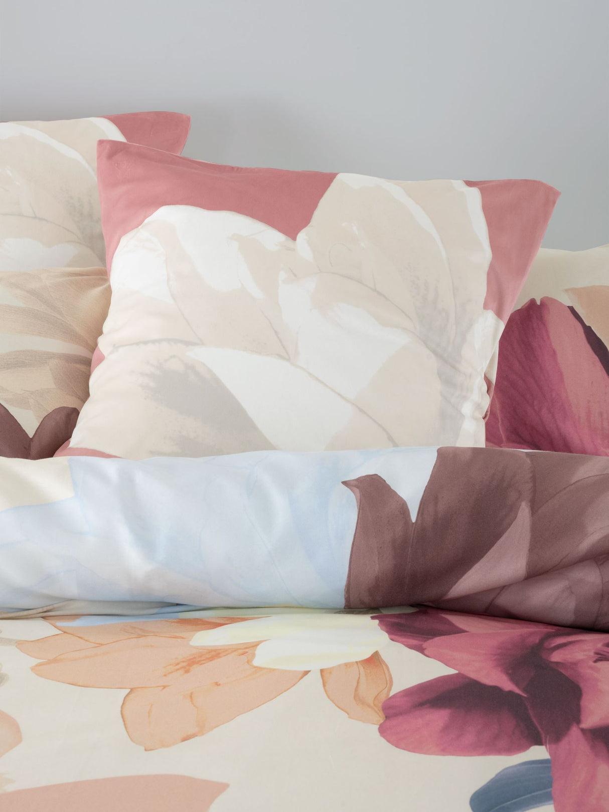 Super King duvet cover set in Shakira Stone features pastel floral prints on soft cotton sateen for luxe bedroom comfort.