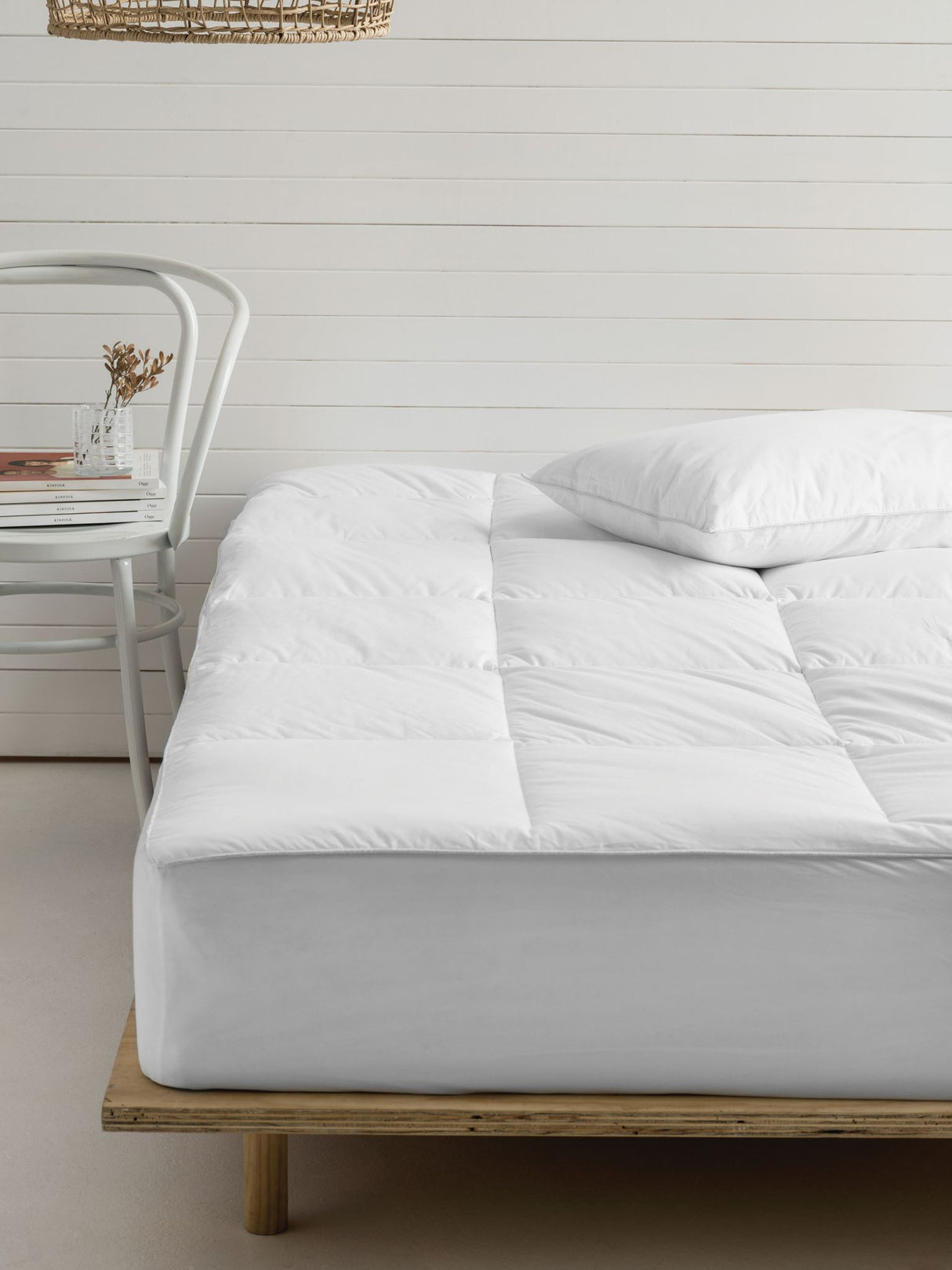 Plush white mattress topper designed for California King beds, featuring 600 GSM polyester fill and breathable Japara cotton cover.