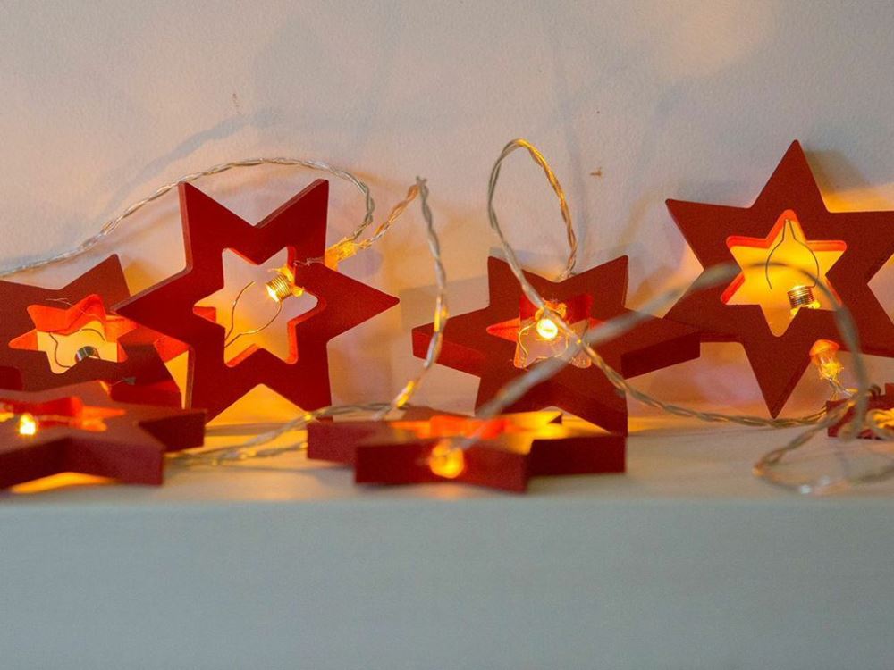 Red Star Fairy Lights Strand with 9 stars, 1.8m long, battery-operated, perfect for year-round enchanting decor.