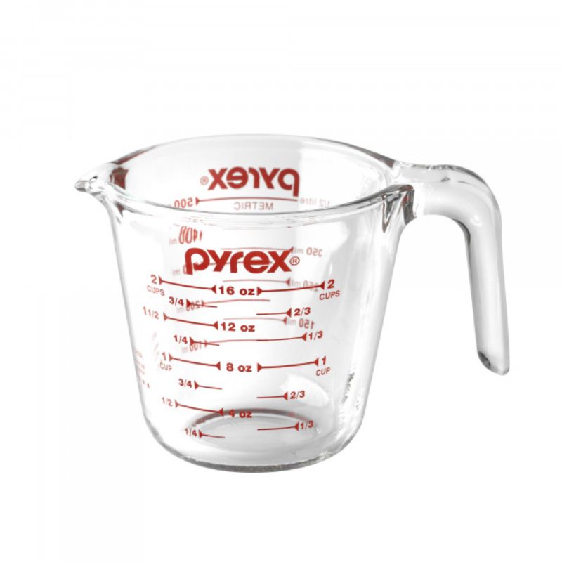 High-quality 2-cup Pyrex measuring jug with clear red markings, durable glass, and ergonomic design for precise pouring.