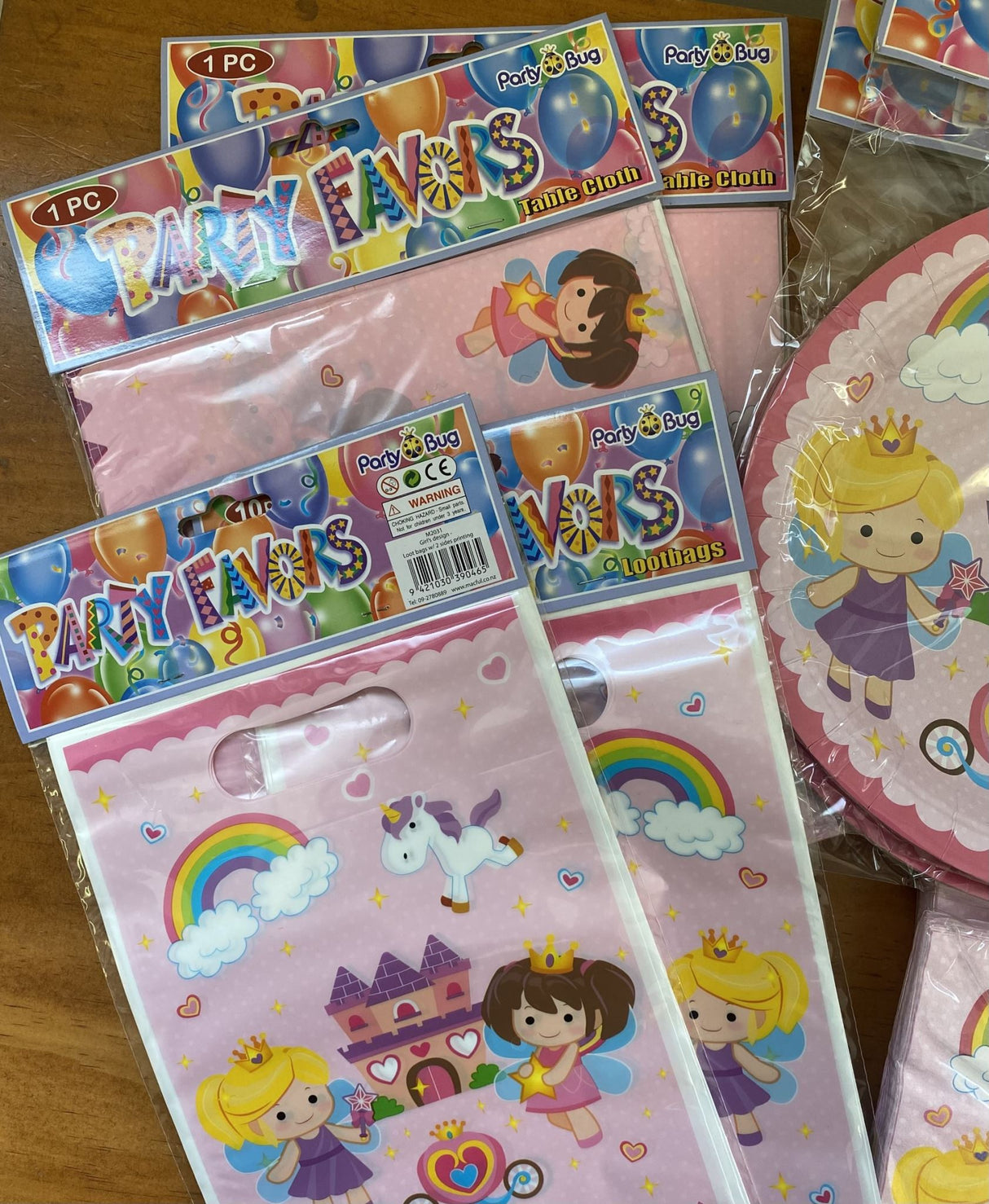 Enchanting fairy princess party tableware set with plates, cups, napkins, and loot bags for magical birthday celebrations.