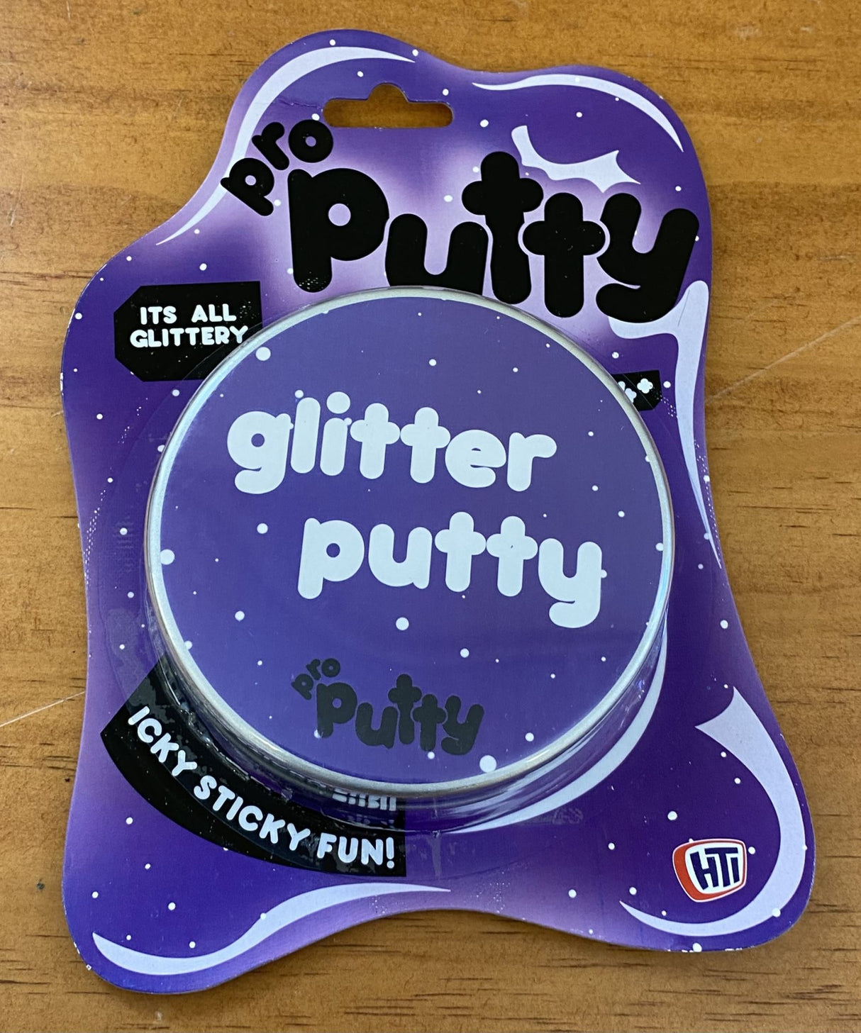 Vibrant purple Glitter Putty, perfect for stress relief and sensory play, shining with captivating glitter effects.