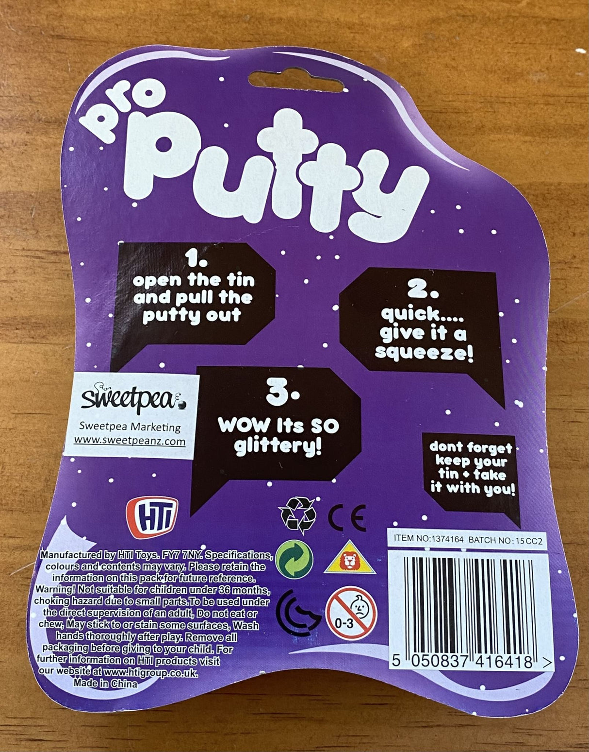 Vibrant purple Glitter Putty sparkling with glitter, perfect for sensory play and stress relief, suitable for kids and adults.