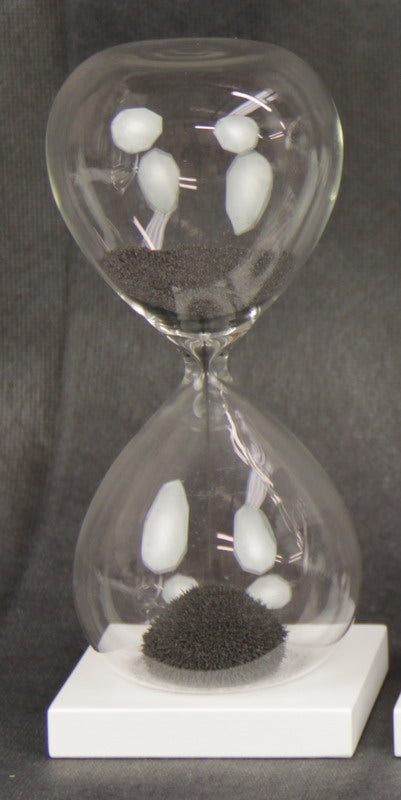 Magnetic Sand Timer in black, 16cm tall, showcases iron sand forming dynamic shapes in a captivating visual display.