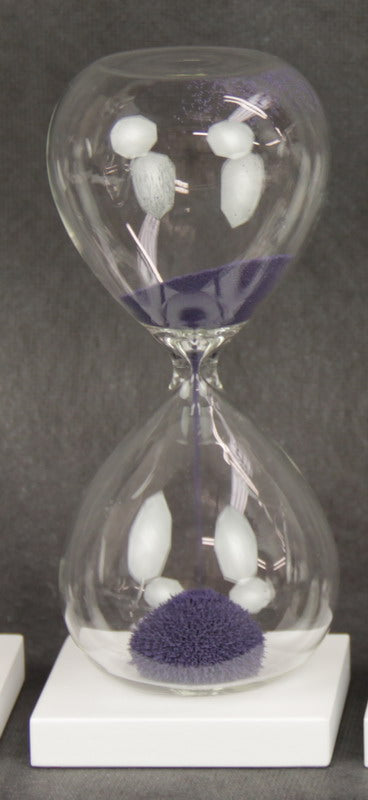 Purple Magnetic Sand Timer (1 Minute) featuring iron ore sand forming unique shapes on a wooden base, ideal for decor and mindfulness.