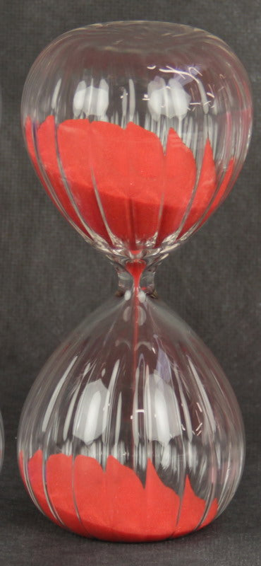 Elegant red hourglass sand timer, 16cm tall, with vibrant red sand, perfect for timing activities and enhancing home décor.