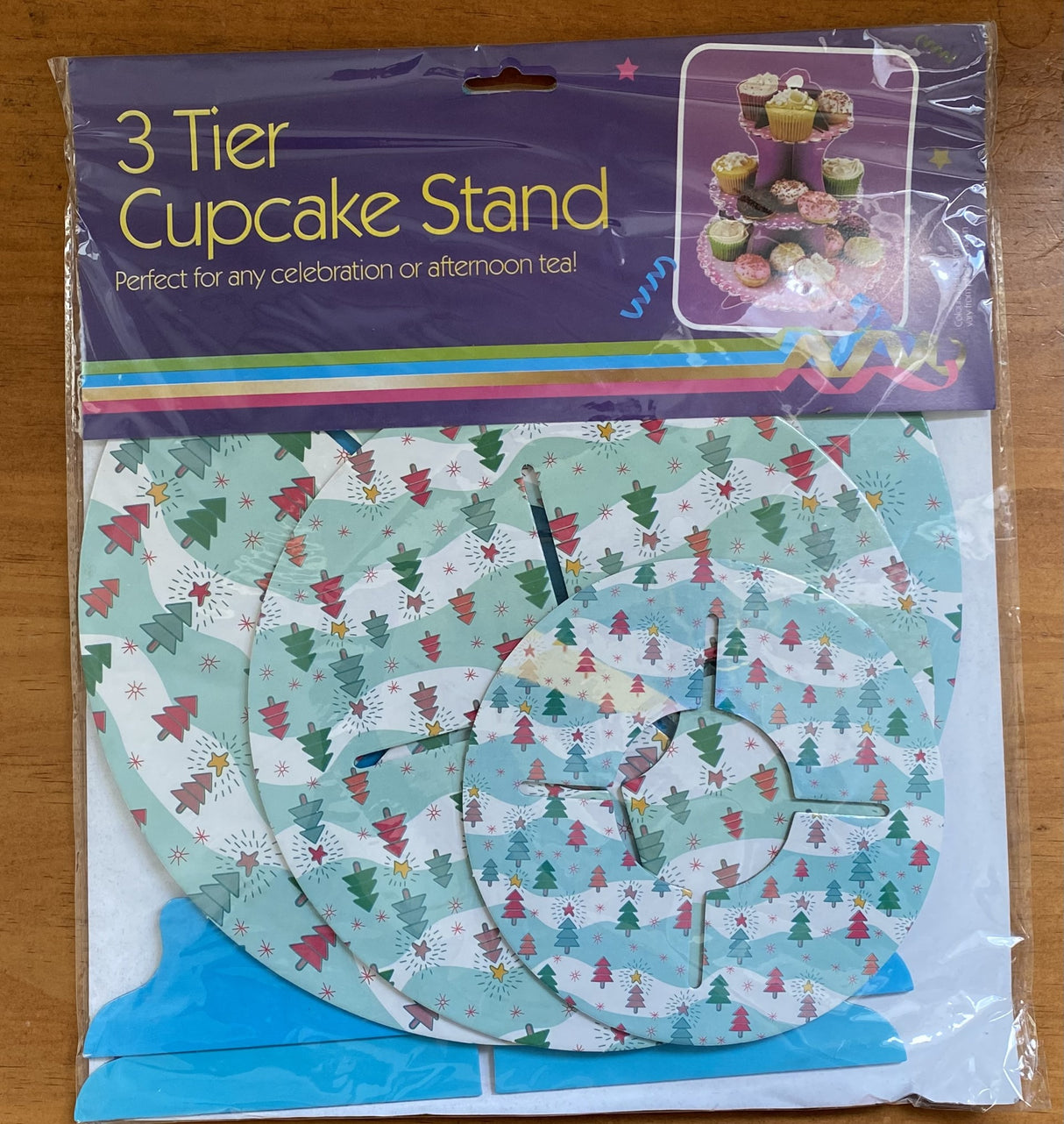 Elegant 3-tier cupcake stand set with assorted Christmas designs, perfect for showcasing festive treats at holiday gatherings.