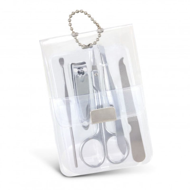 Clear vinyl manicure set containing scissors, nail clippers, cuticle pusher, nail file, and tweezers, perfect for grooming on-the-go.