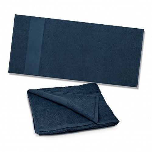 Plush navy beach towel made from 420gsm cotton terry, measuring 700mm x 1400mm, perfect for relaxing by the shore.