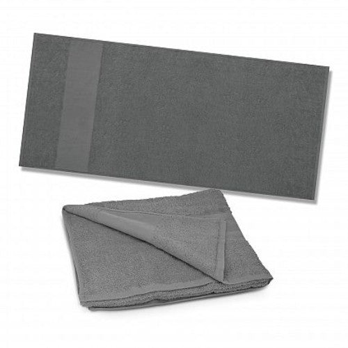 Dune Beach Towel in grey, made from plush 420gsm cotton, perfect for lounging or drying off at the beach.