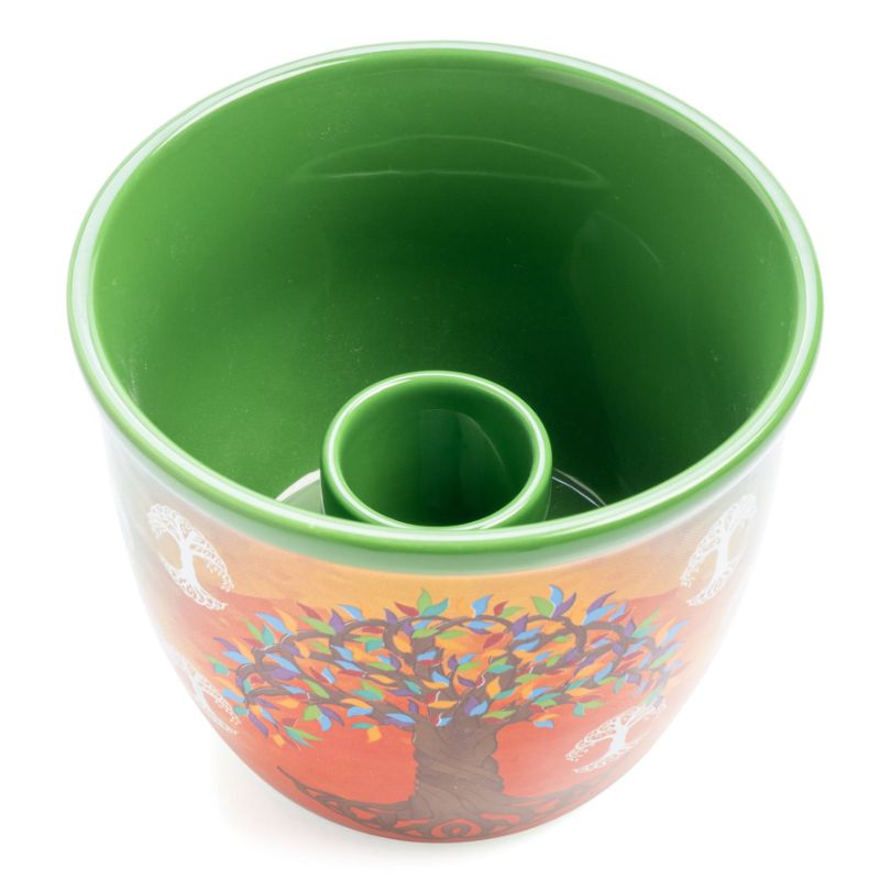 Ceramic smudge bowl with a vibrant tree of life design, perfect for holding sage and catching ashes during rituals.