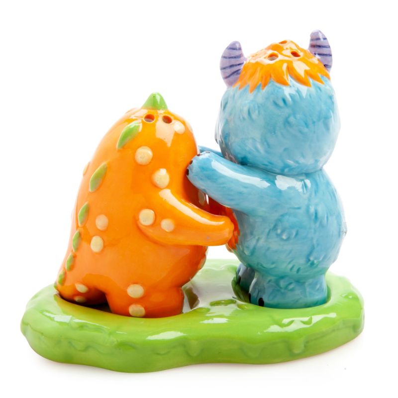 Cute ceramic salt and pepper shakers shaped like Monsterlings Roary and Borg, displayed in a green slime holder.
