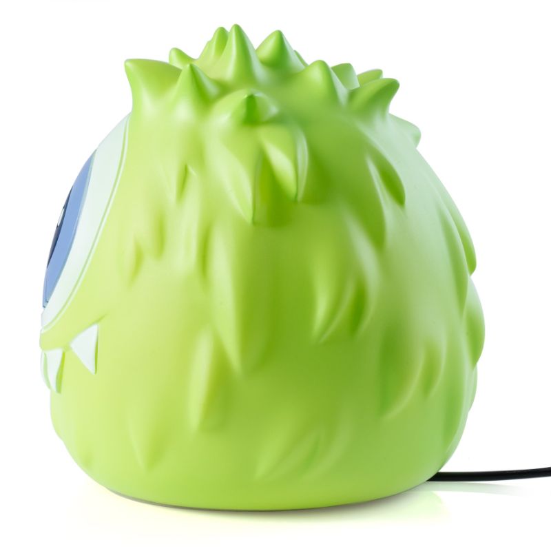 Adorable green Monsterling Oli table lamp, 16cm tall, provides warm glow and doubles as a stylish decor piece for kids' rooms.