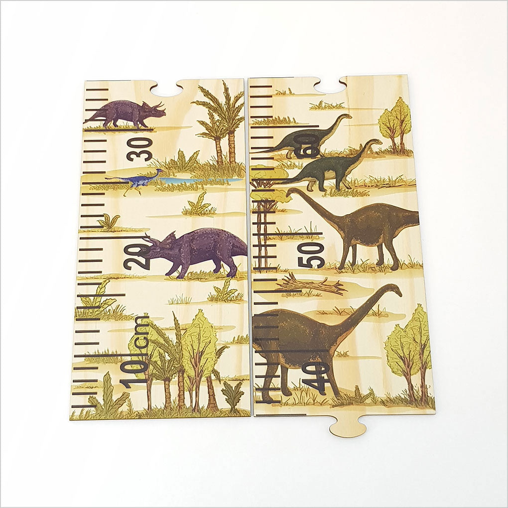 Height chart ruler featuring vibrant dinosaur illustrations, crafted from eco-friendly pine veneer, with interactive puzzle pieces.