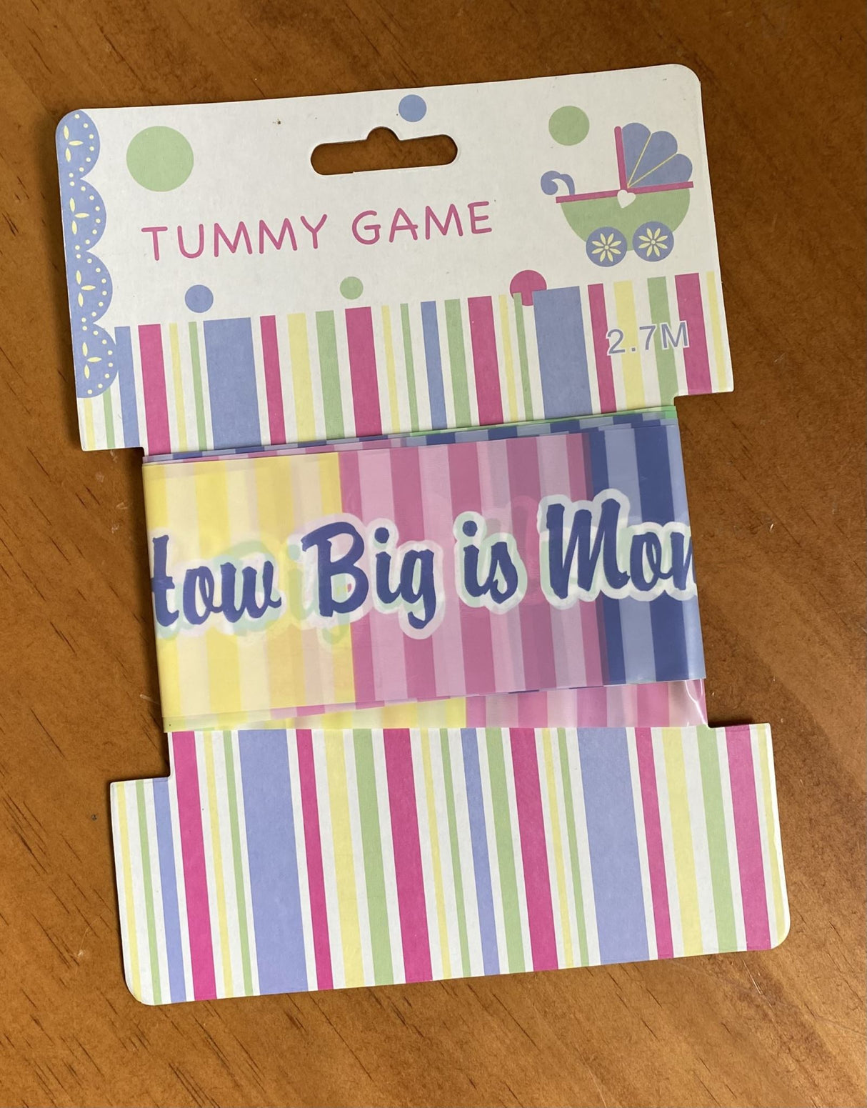 "Fun baby shower game to guess baby bump size, perfect for laughter and memories at gatherings."