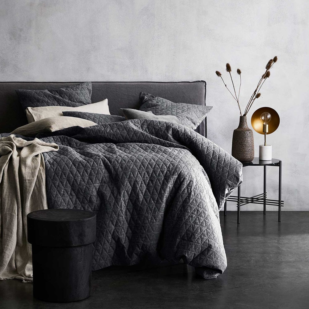 Luxurious greystone chambray quilted duvet cover, made of linen-cotton blend for a relaxed, vintage charm.