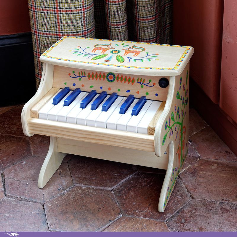 Colorful Animambo Electric Piano with 18 vibrant keys, wooden design, and included sheet music for children's musical exploration.