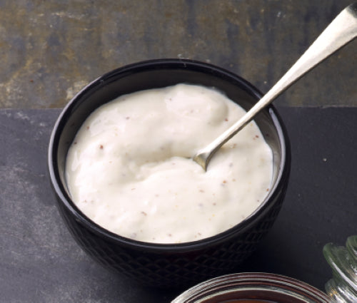 Creamy Sauce Tartare in a 5L bottle, perfect for enhancing seafood dishes with a zesty flavor.