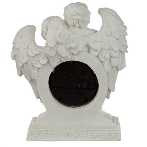 Elegant mantle clock featuring cherub details, perfect blend of style and functionality, evokes love and tranquility.