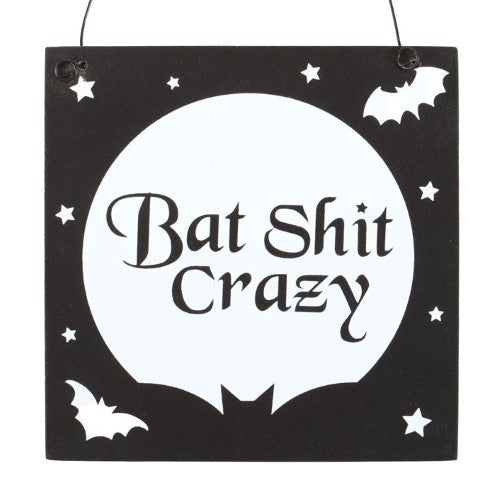 Square wooden sign featuring the phrase "Bat Shit Crazy," blending humor and gothic style for unique home decor.