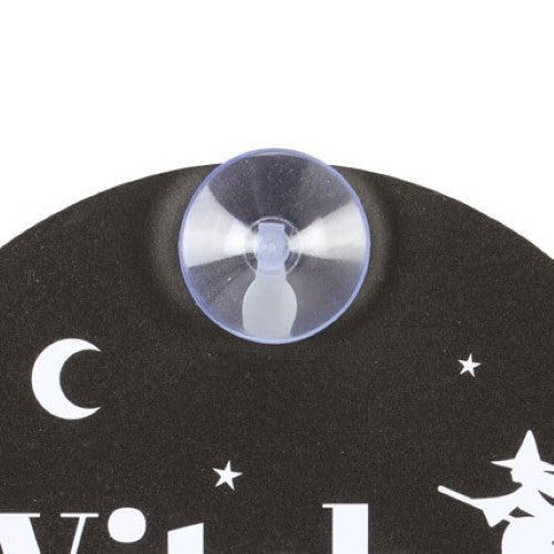 Whimsical 'Witch at the Wheel' window sign with crescent moon and stars, perfect for adding magic to decor or car.