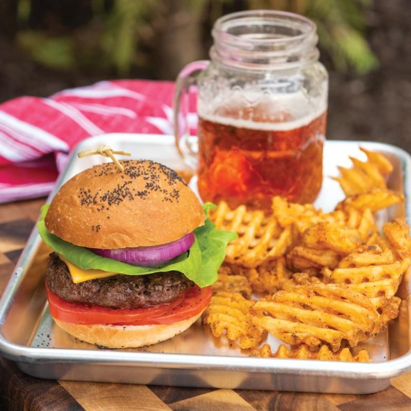 Durable natural aluminum quarter sheet pan, ideal for baking small batches and reheating meals with easy handling.