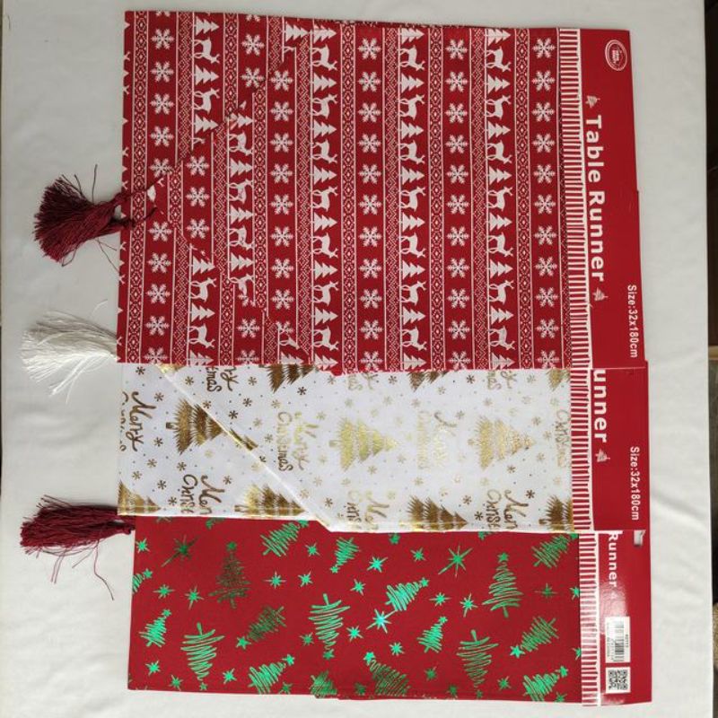 Festive set of 12 Christmas table runners, 32x180cm, in assorted designs for elegant holiday dining decor.