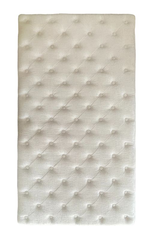 Luxurious cream oversized ottoman measuring 1.4m, serves as stylish storage, extra seating, and decor for any bedroom.