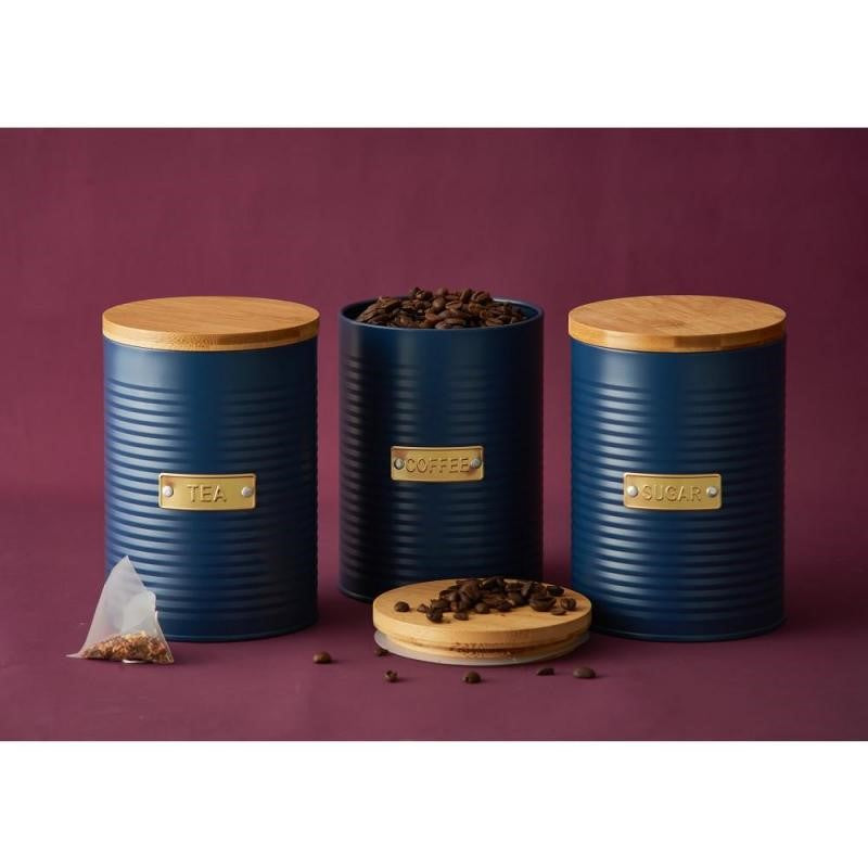 Navy tea storage canister with ribbed design, bamboo lid, and 1.4L capacity for keeping tea fresh and stylish.