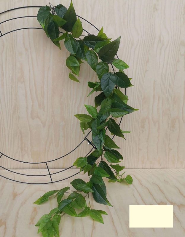 Lifelike 1.8m artificial persimmon garland with vibrant fruits and rich green leaves, perfect for year-round home decor.