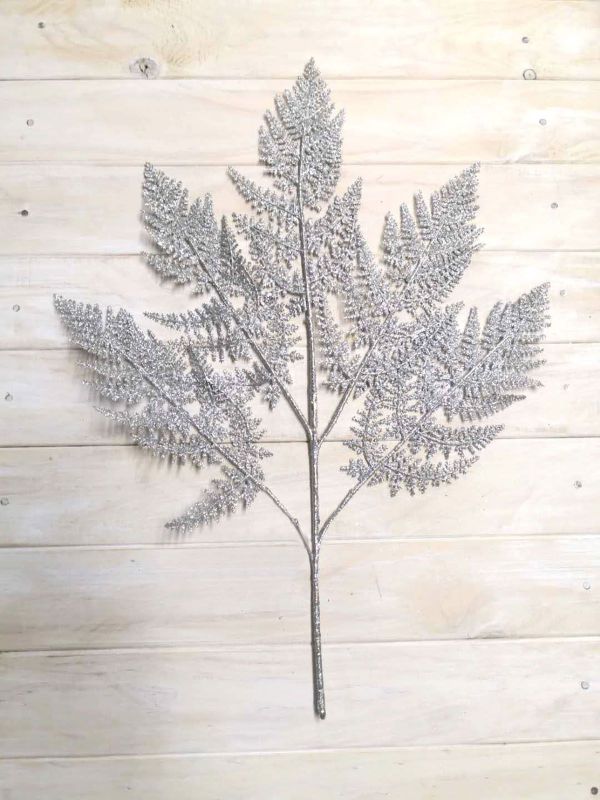 Artificial Fern Spray in shimmering silver glitter, 60 cm tall, elegantly styled for home décor and special occasions.