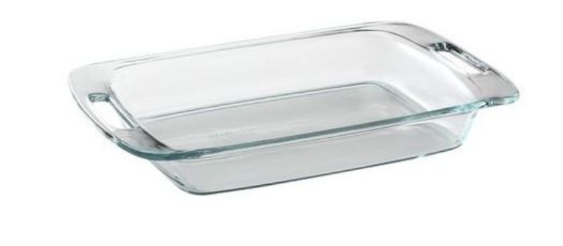 Set of 4 Pyrex Easy Grab® 2.8L oblong baking dishes with ergonomic handles for easy transport and versatile cooking.