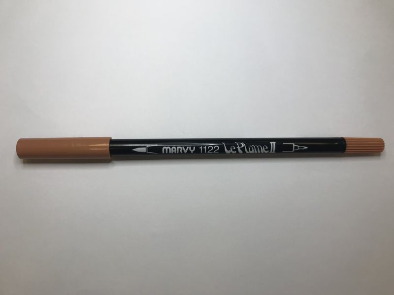 Light brown dual tip marker with a large brush and fine tip, perfect for artists and crafters seeking versatile coloring tools.
