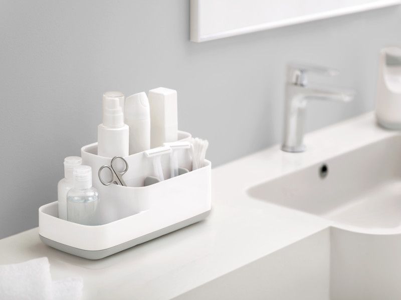 Joseph Joseph EasyStore Bathroom Caddy in grey and white, featuring multiple compartments for organized grooming essentials.