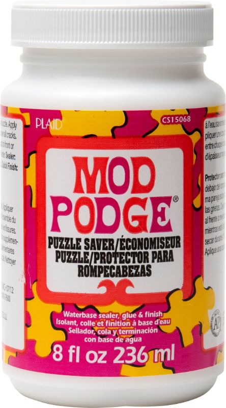 A 4oz bottle of Mod Podge Puzzle Saver, ideal for preserving puzzles with a quick-drying, clear, glossy finish.