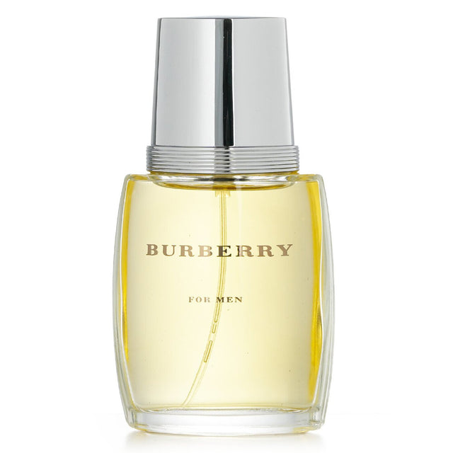 Burberry Eau De Toilette Spray 50ml - a sophisticated woody aromatic fragrance for modern men, blending fresh and warm notes.