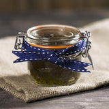 Kilner 125ml Round Clip Top Jar with orange seal, ideal for storing dry foods and homemade preserves.