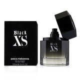 Paco Rabanne Black Xs Eau De Toilette Spray for men, featuring fresh citrus notes, sweet praline, and warm woody elements.