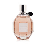 Viktor & Rolf Flowerbomb Eau De Parfum in a 100ml bottle features a floral fragrance of jasmine, rose, and patchouli, perfect for evenings.