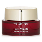 Clarins Lisse Minute 15ml makeup base, perfects skin by filling lines, brightening dullness, and creating a smooth finish.