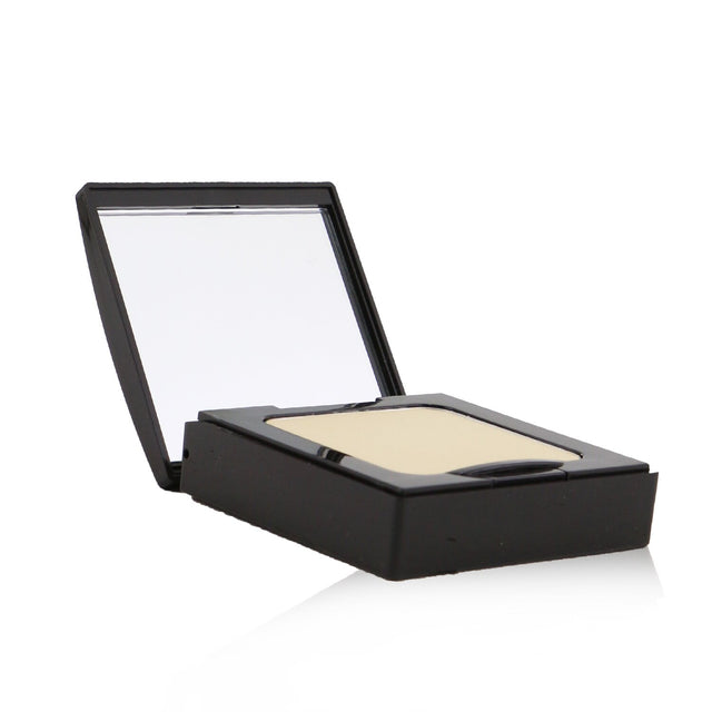 Laura Mercier Pressed Setting Powder in Translucent, 9g/0.3oz, offers a silky, oil-free formula for a flawless finish.