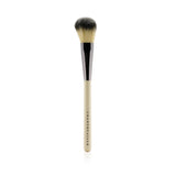 Handmade Chantecaille Cheek Brush with ivory handle and durable ferrule for flawless contouring and shade application.