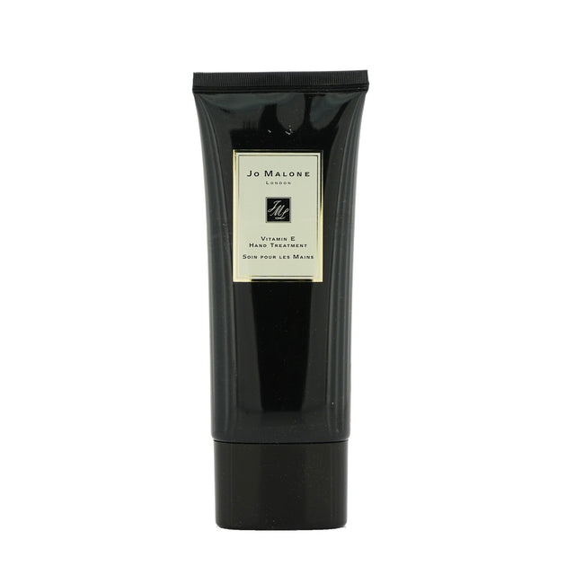 Luxurious Jo Malone Vitamin E hand cream in 100ml, deeply nourishes skin with pomelo and cassis scent, leaving hands soft.