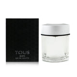 Elegant bottle of Tous Man Eau De Toilette Spray, featuring refreshing notes of grapefruit, orange, pepper, and sage.