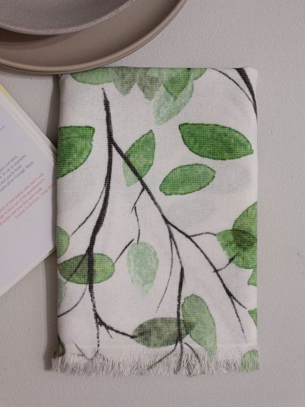 Kitchen towel featuring green leaves design, 100% cotton with plush terry back, OEKO-TEX certified, perfect for home use.