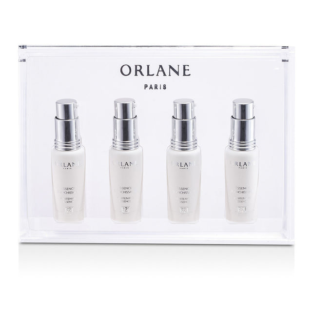 Orlane B21 Whitening Essence in 4x7.5ml ampoules, designed to lighten dark spots and enhance skin radiance and clarity.