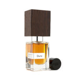 Elegant Nasomatto Duro Extrait De Parfum in 30ml, featuring bold hardwoods, leather, and spices for the modern gentleman.